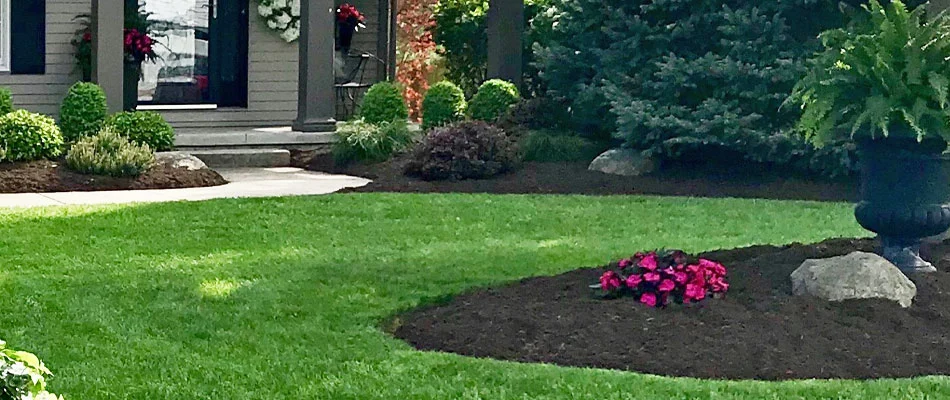 Dark landscaping mulch installed at a home in Vermilion, OH.